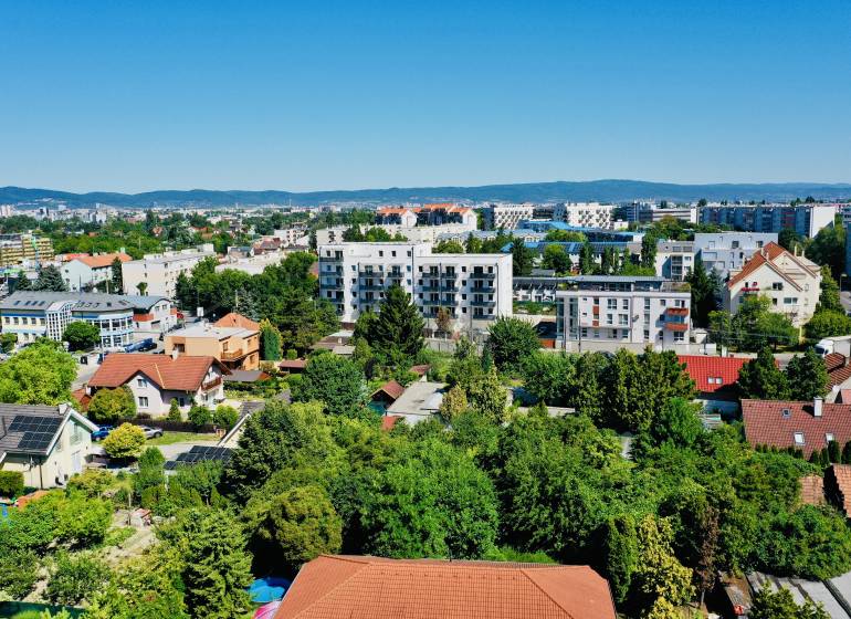 View of greenery and buildings in Bratislava - Podunajské Biskupice, Geologická Street.