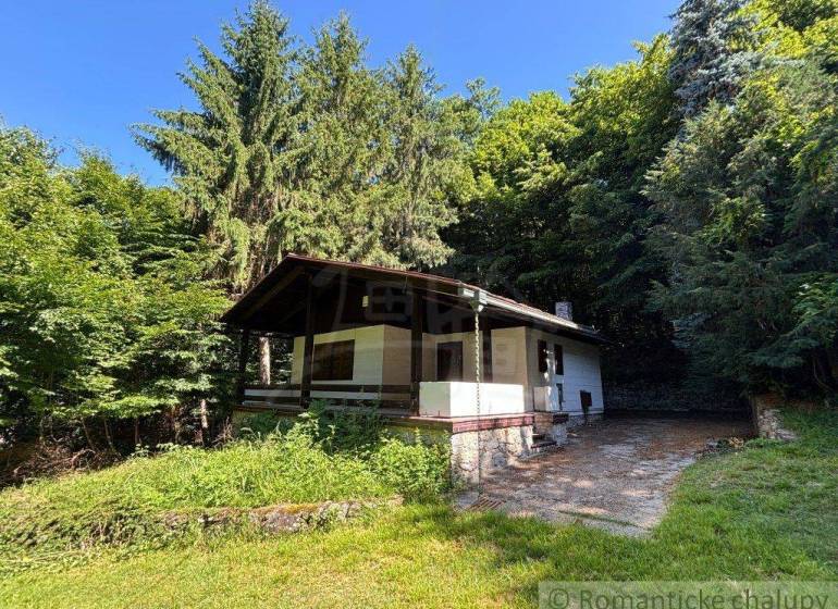A family house in Malacky surrounded by dense forests and grassy environment.
