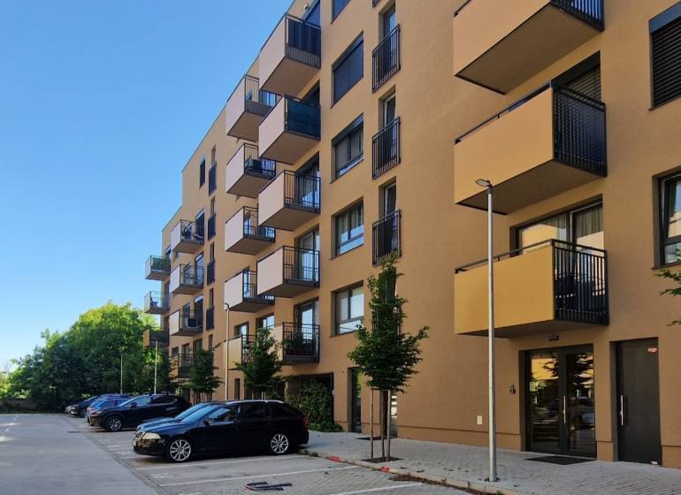 Apartment building on Sadova Street in Senica with parking and balconies for 2-room apartments.