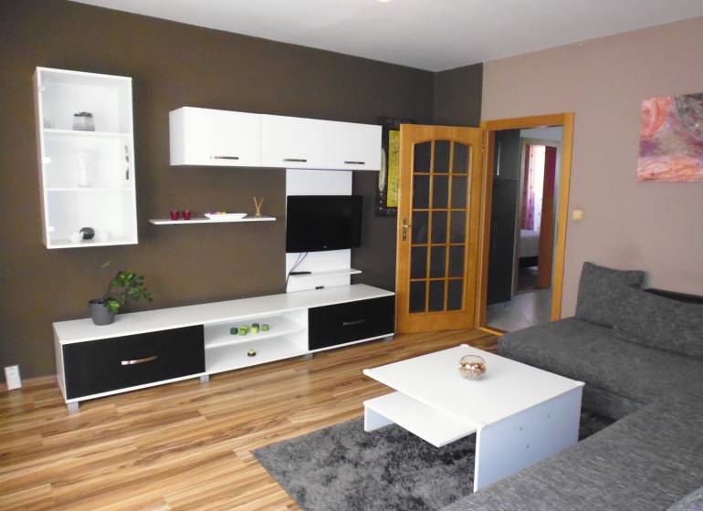 Living room with a TV, sofa, and furniture in a 3-room apartment.