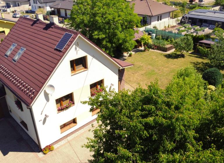 A family house in Kriváň on Kriváň street with a spacious garden and well-maintained lawn.