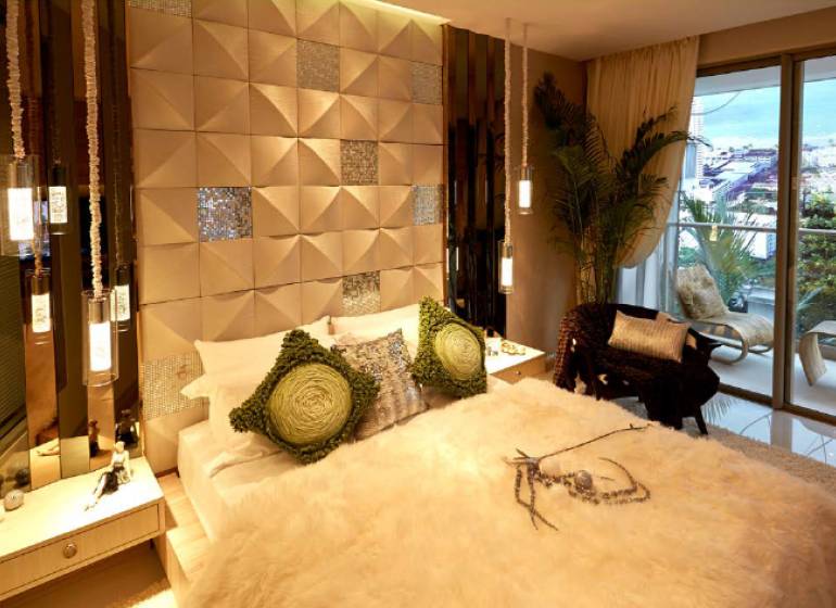Luxury bedroom in a studio apartment with cozy lighting and a balcony.
