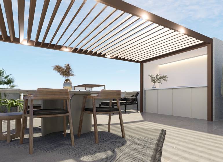 A terrace in a 4-room apartment with a pergola, table, chairs, and plants for relaxation.