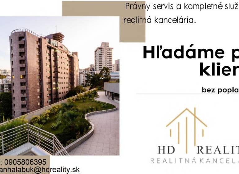 A building surrounded by greenery, next to modern residential blocks in Banská Bystrica.