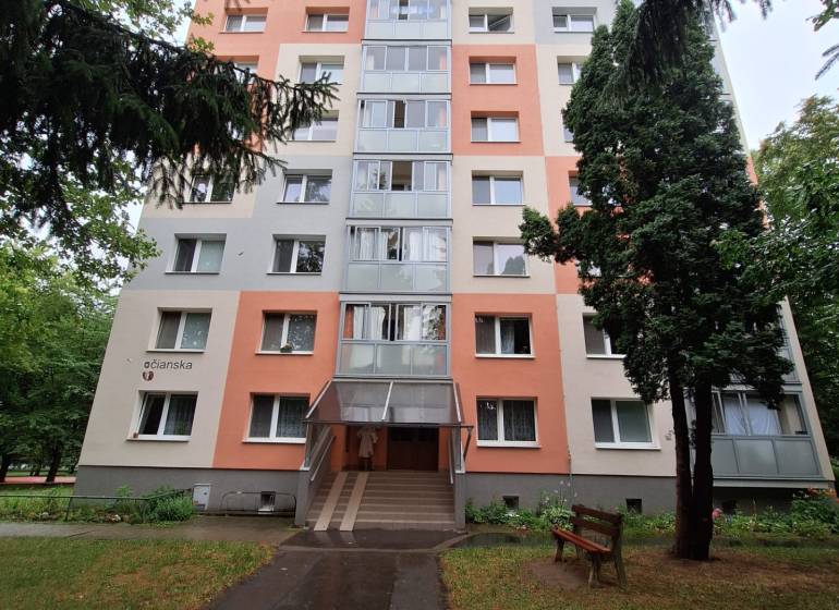 An apartment building on Trenčianska Street in Nová Dubnica surrounded by greenery.