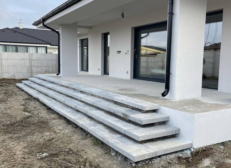 Family house in Western Slovakia with a concrete terrace and stairs, ready for completion.