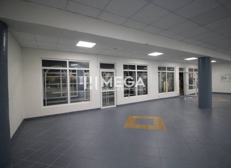 Commercial premises with tiled floors and glass walls.