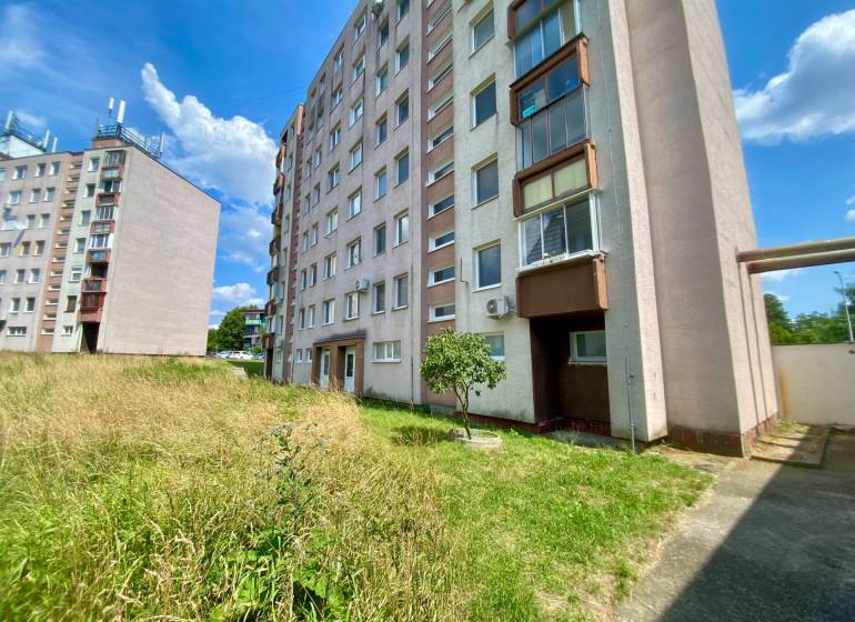 Apartment buildings with greenery and blue sky on Jilemnického Street in Stupava.