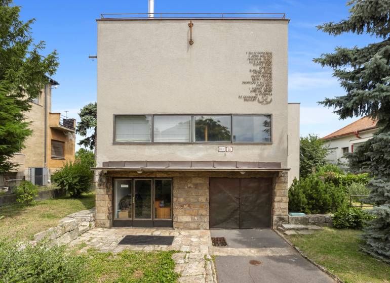 Family house on Mudroňova Street in Bratislava - Old Town with a front garden and a pine tree.