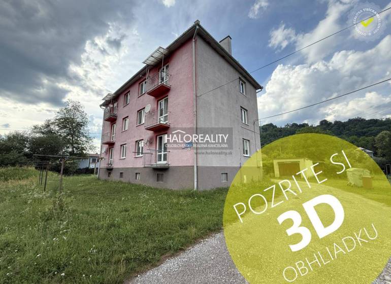 Exterior of an apartment building in Hnúšťa with a 3-room apartment and green surroundings.