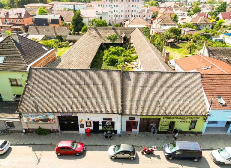 Unusual properties on P. O. Hviezdoslav Street in Nové Mesto nad Váhom, surrounded by houses.