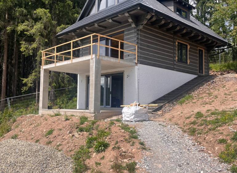 A cottage in Korňa surrounded by forest with a terrace in the middle of nature for sale.