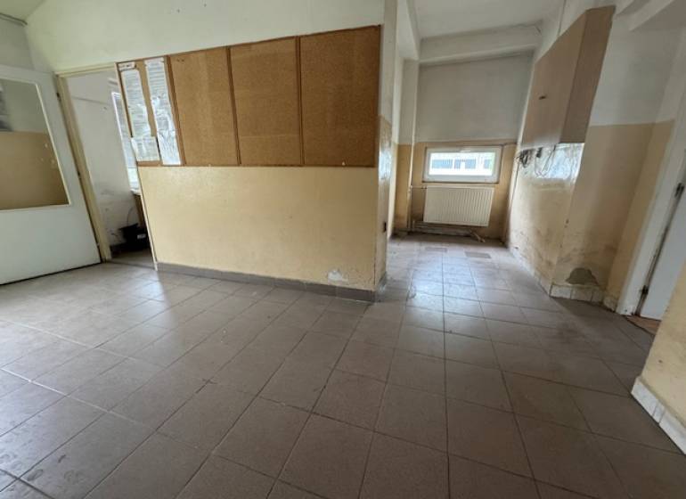Commercial premises with tiles and glass doors.