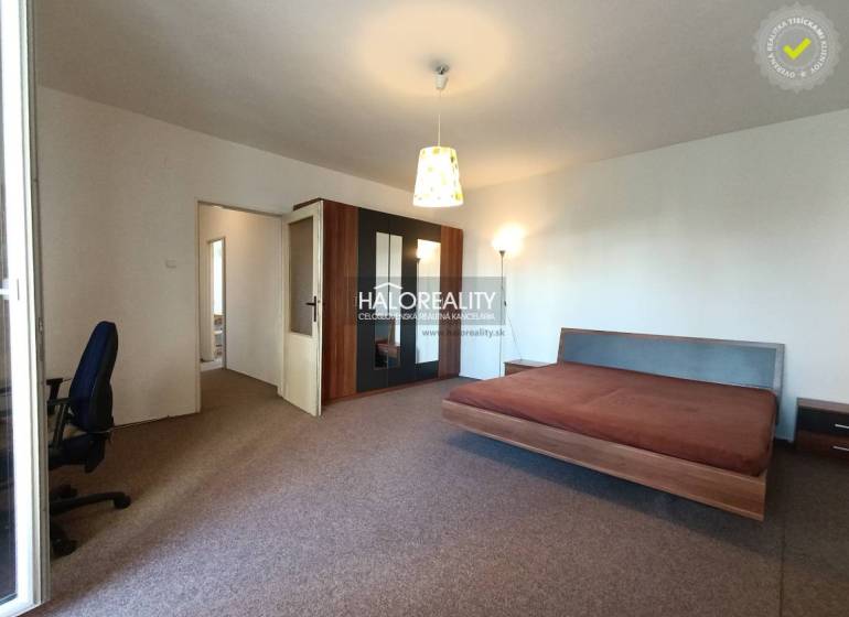 1-bedroom apartment with a spacious bed and wardrobe, rear entrance available.