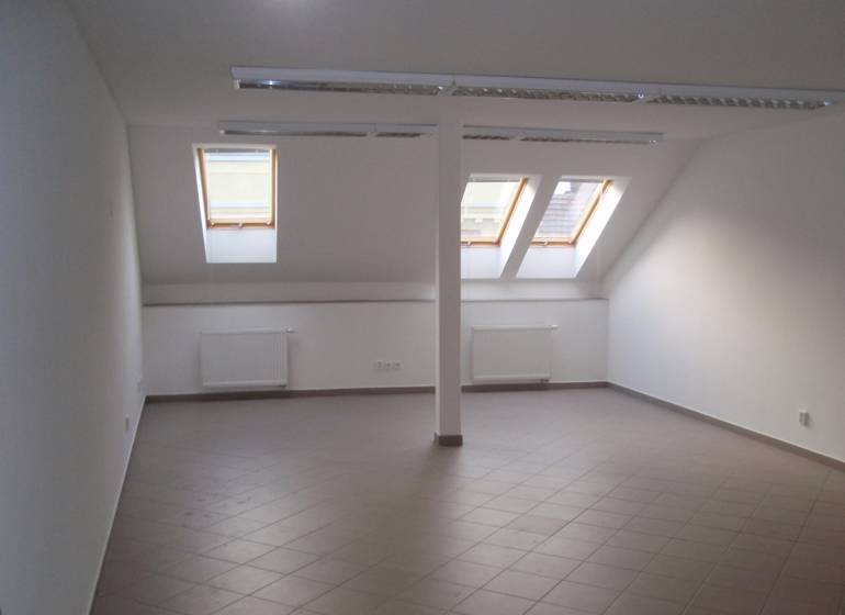 Attic offices with windows, tiling, and heating.