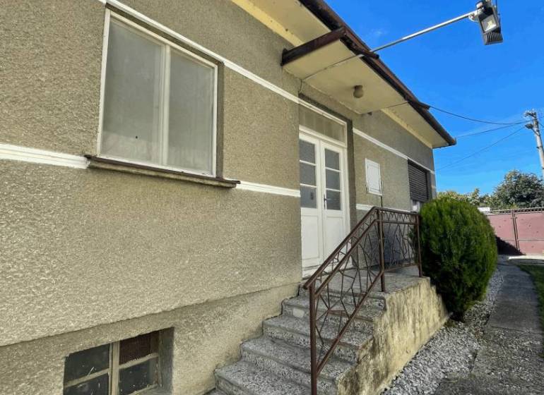 Family house in Veľké Blahovo with an entrance staircase and a side walkway.