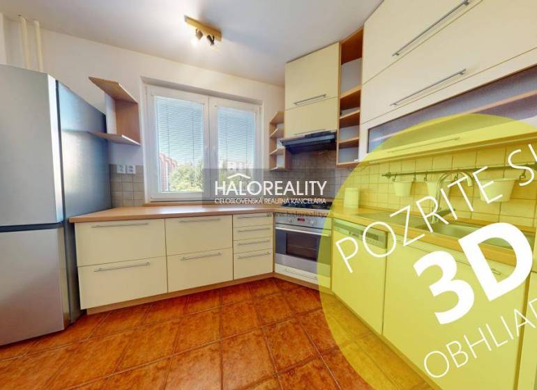 Kitchen in a 4-room apartment with equipment and a view from the window.