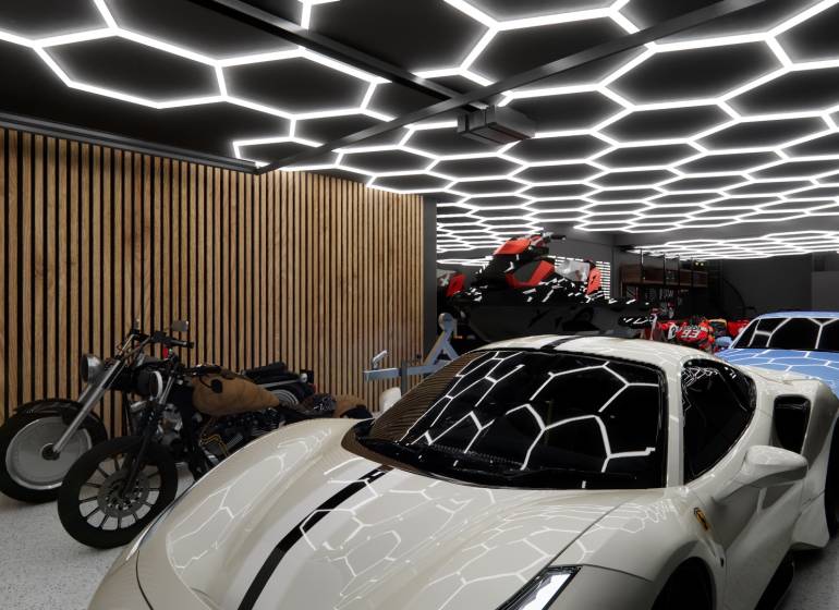 Showrooms with cars, motorcycles, and unique ceiling lighting in the garage.