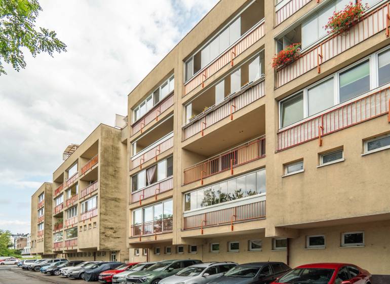 Apartment building on Mierová Street in Bratislava - Ružinov, surroundings with cars and greenery.