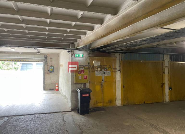 Garages with yellow doors, a trash can, and an exit, interior.