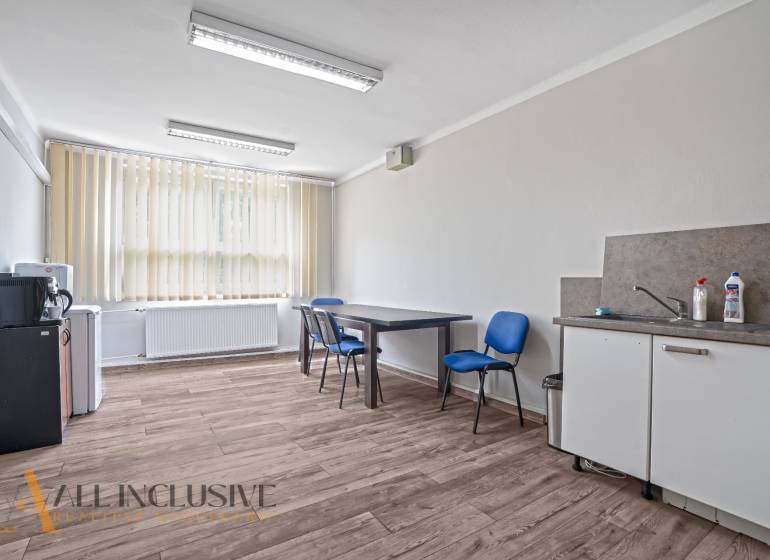 The office equipment includes a desk, chairs, a sink, a faucet, and blinds.
