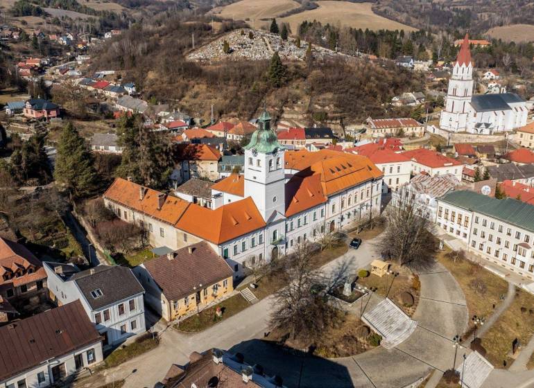 Aerial view of the historic part of the town of Gelnica with Banícke Square, hotels, and guesthouses.