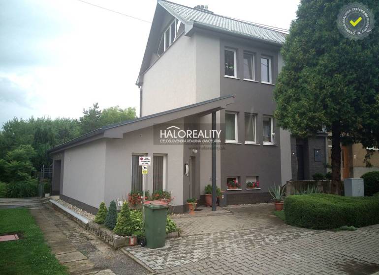 A family house in Nováky with a well-maintained garden, parking space, and landscaped surroundings.