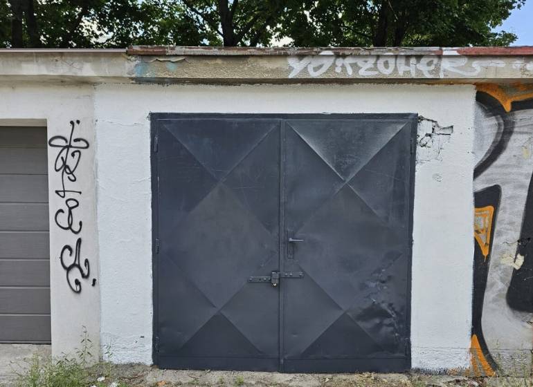 Garages on Kukučínova Street in Bratislava - Nové Mesto, with graffiti on the walls.