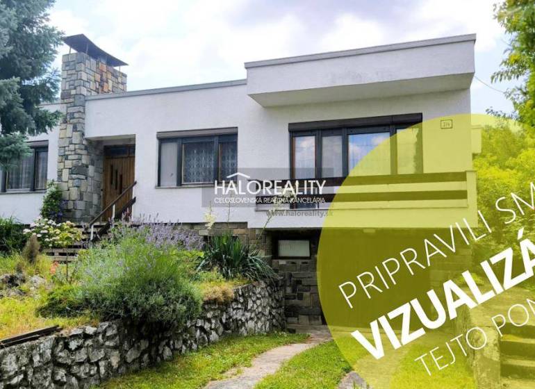 A family house in Plavecký Mikuláš surrounded by a well-maintained garden and flowers.