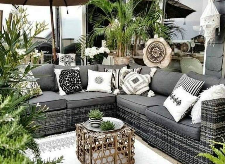 The terrace of a family house in Tašula with garden furniture and plants.
