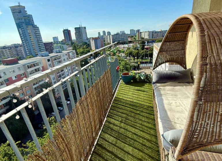 A balcony with comfortable seating in a 2-room apartment on Jégého Street in Bratislava - Ružinov.