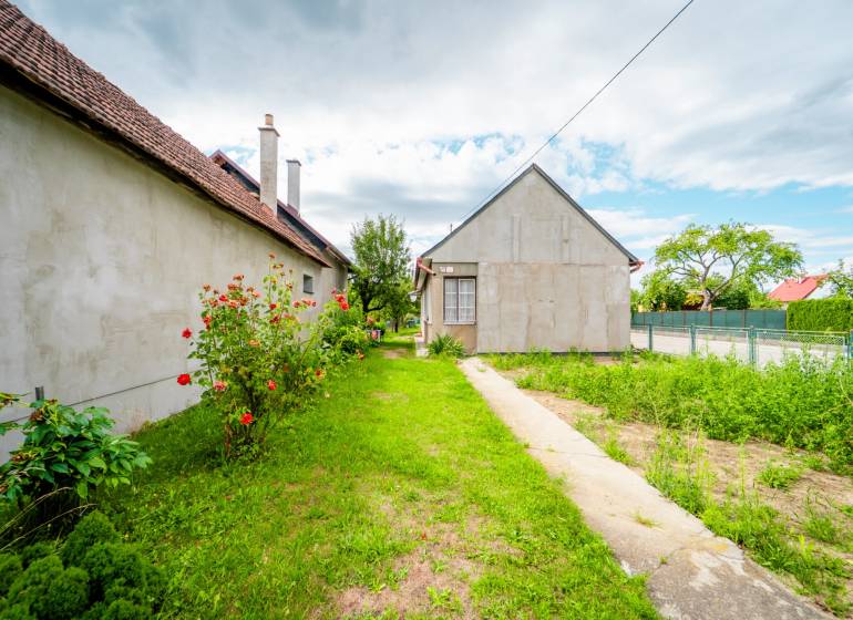 Family house on Pavla Koyša in Ladce with yards and flowers.