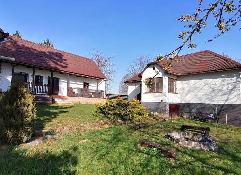 A family house with a garden and a fire pit in the yard, ideal for relaxation.