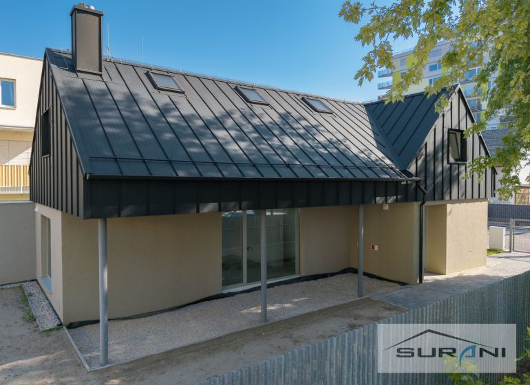 A family house on Železničná Street in Bratislava - Ružinov with a modern roof and fence.