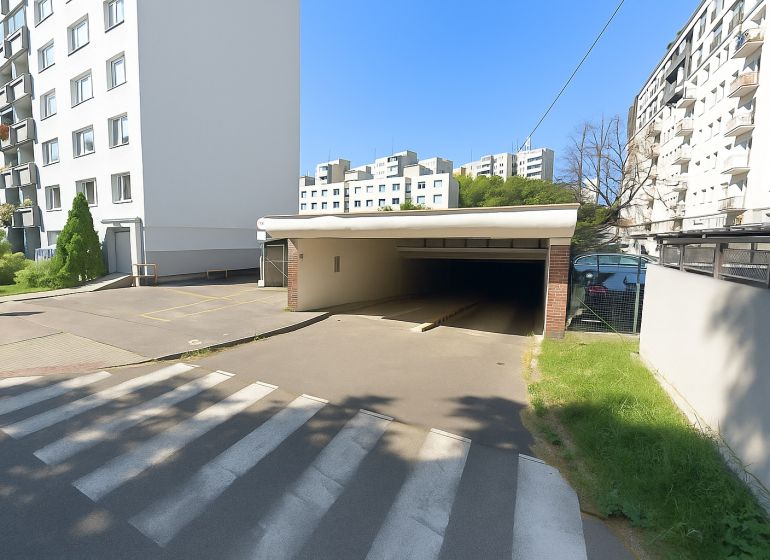 Entrance to the garages on Ondavská Street in Bratislava - Nivy surrounded by apartment buildings.