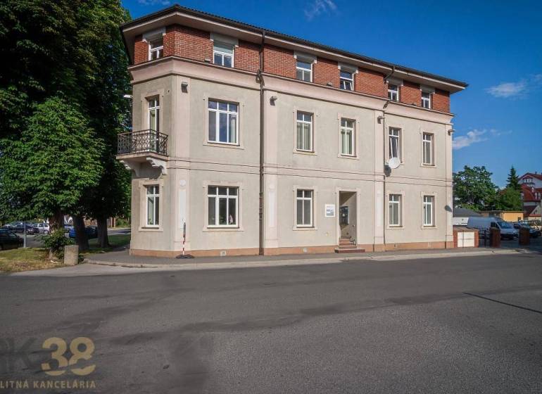 A building on Halatova Street in Poprad with a balcony and large windows.
