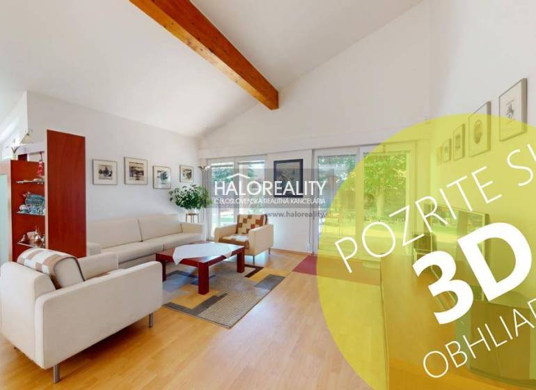 Living room in a family house with wood-patterned flooring, comfortable seating, and decorations.