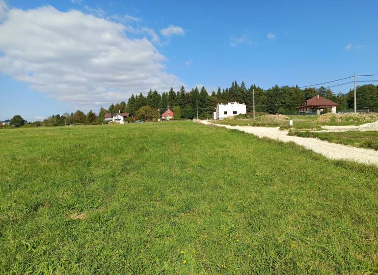 Residential plots in Stránske on Stránske Street with a view of houses and greenery.