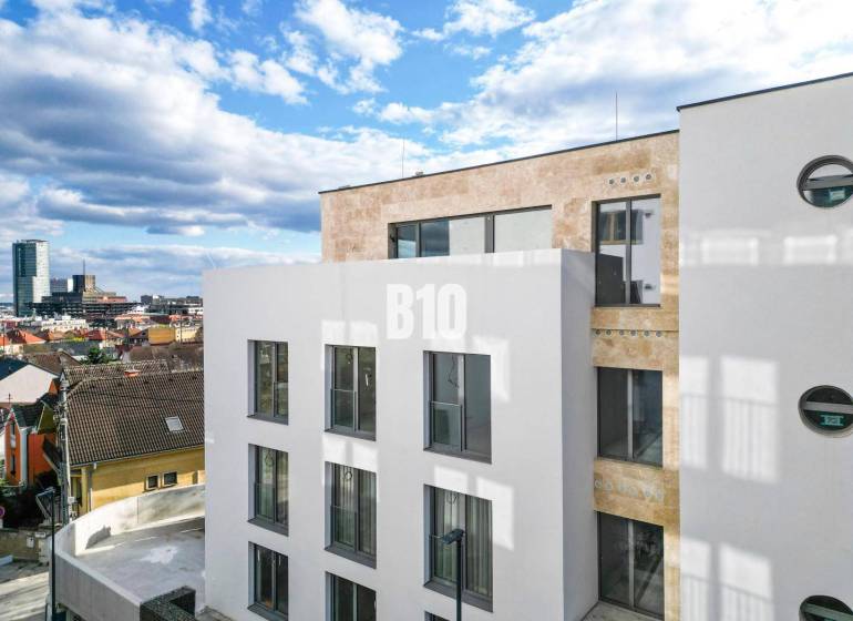 White building with large windows in Bratislava III on Matúškova with a 3-room apartment.