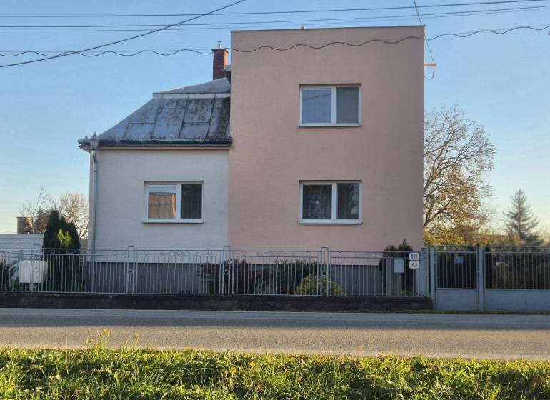 A family house on Kpt. Nálepku Street in Trebišov with a section plastered in beige.