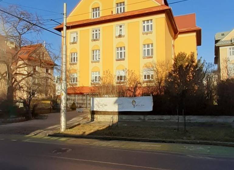 Yellow building with a sloped roof on Brnianska Street, Bratislava - Old Town.