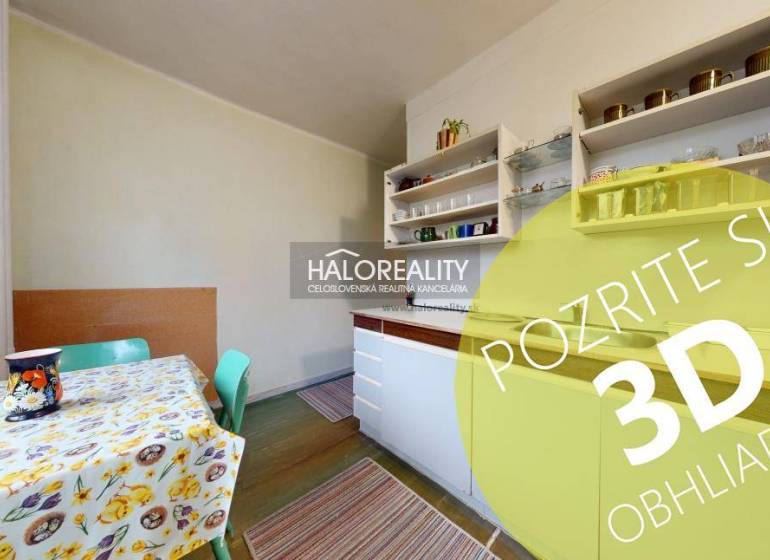 A kitchen in a 3-room apartment with a colorful table and shelves. Floor with wood decor.