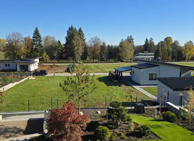 Kováčová offers residential plots with modern houses surrounded by greenery and trees.