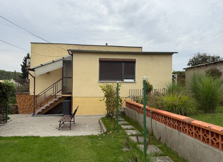 A family house on Jilemnického Street in Dvory nad Žitavou with a landscaped garden and terrace.