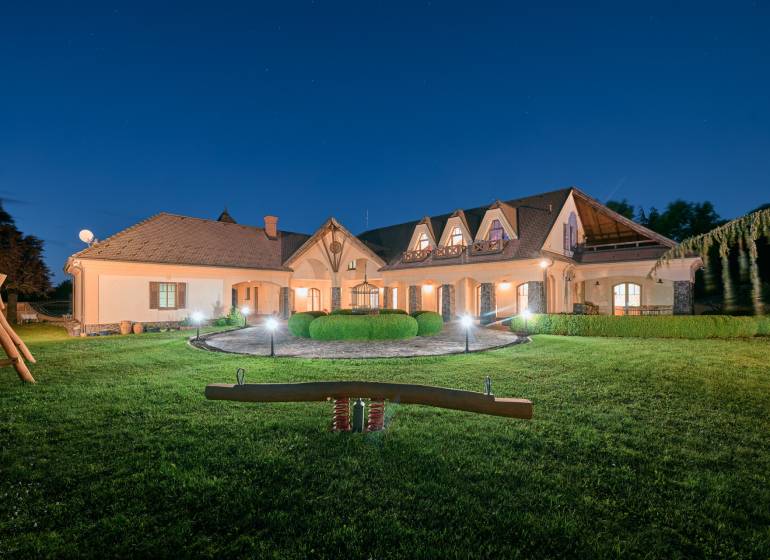 A villa on Park Street in Hviezdoslavov with a lit garden and a children's playground.