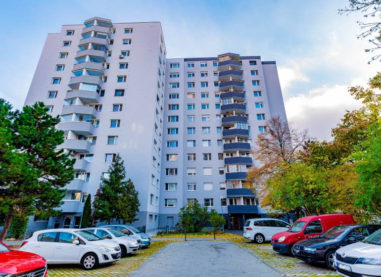 Apartment building on Ján Smrek Street in Bratislava - Devínska Nová Ves, with a parking lot.