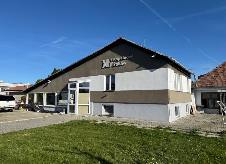 The commercial spaces in Dolné Chlebany stand out with large windows and a modern facade.