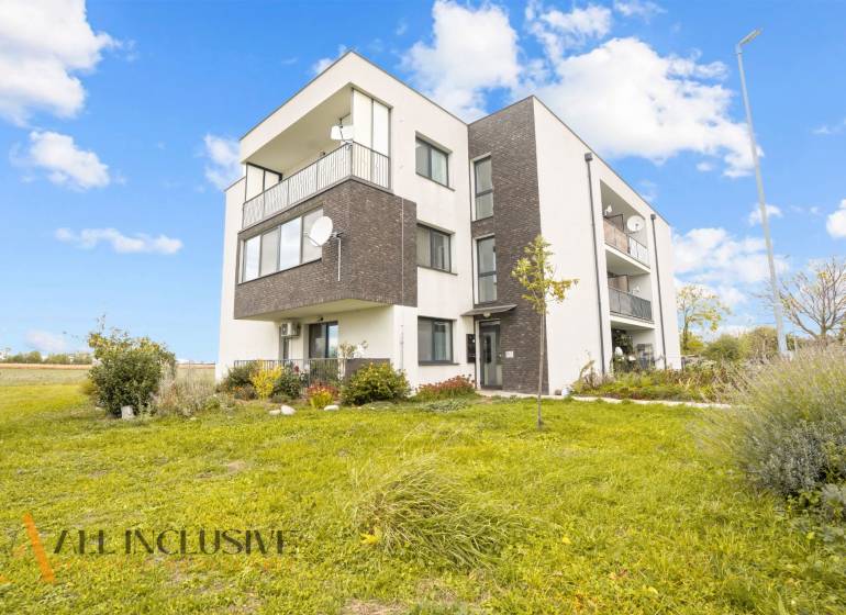 An apartment building surrounded by greenery in Blatná na Ostrove, including space for a 3-room apartment.