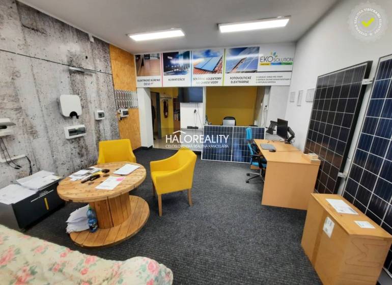 Offices with exposed solar panels, wooden elements, and yellow chairs.