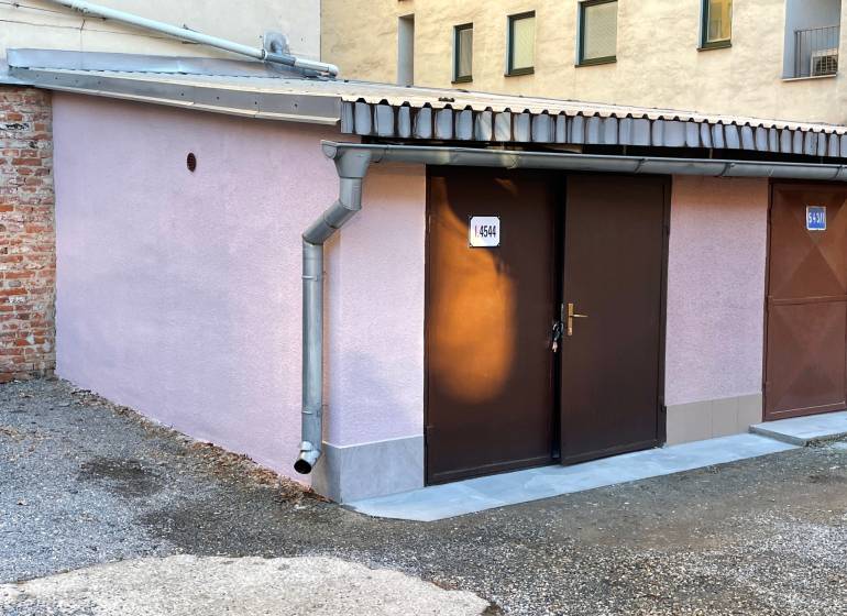 Garages on Mlynska Street in Košice - Staré Mesto district with light purple plaster.